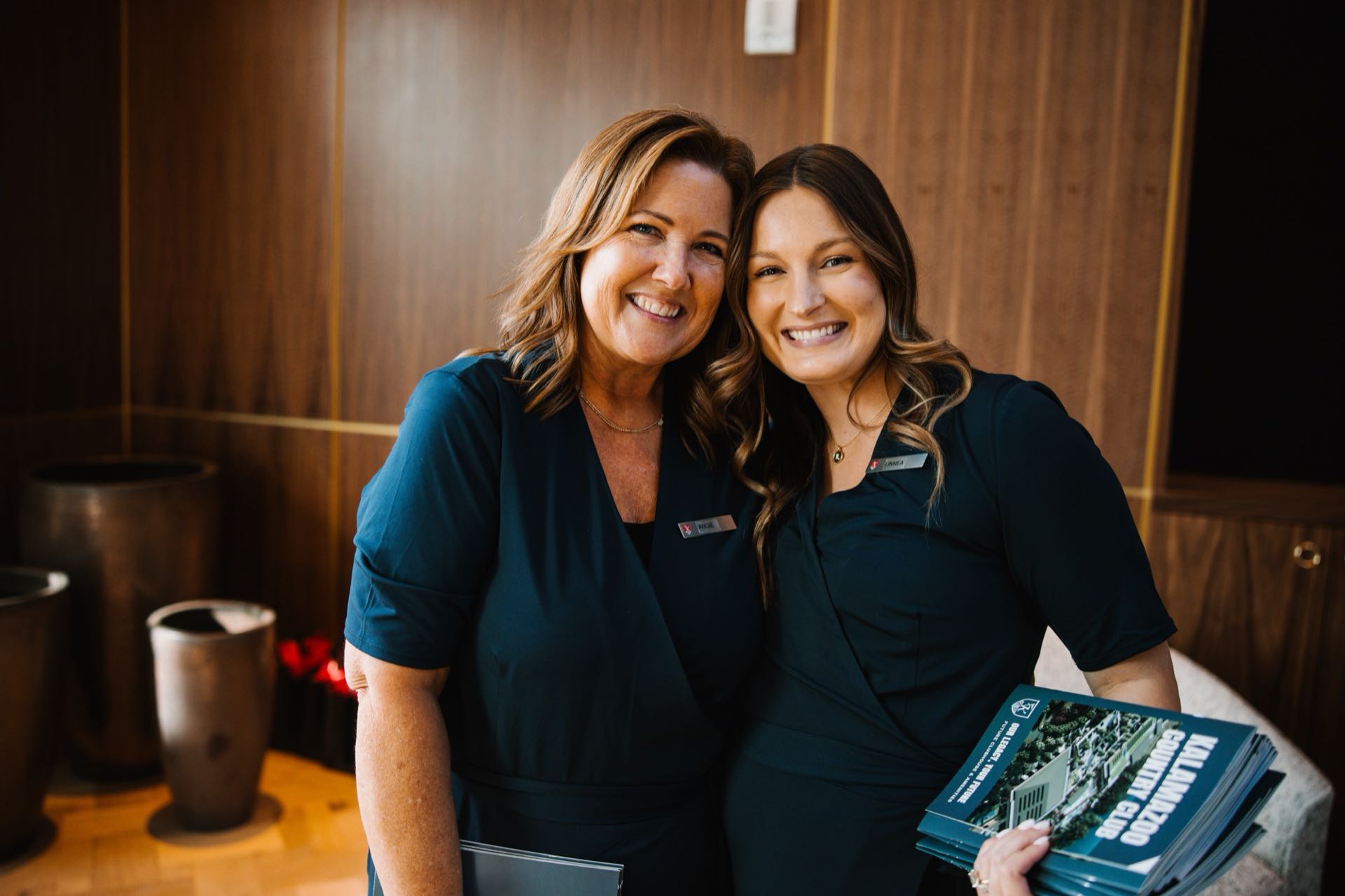 Two Kalamazoo Country Club team members at a member event